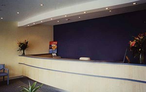 Long reception counter with curved front for medical center